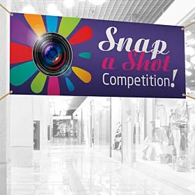Colorful premium vinyl banner hanging in a bright shopping center